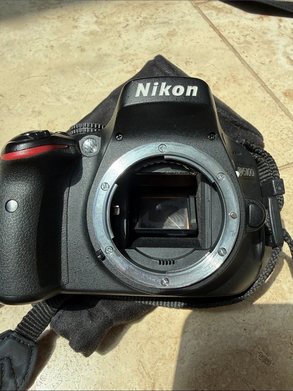 Nikon D5100 DSLR camera, 18-55mm lens, extra zoom 55-200mm, accessories, & bag